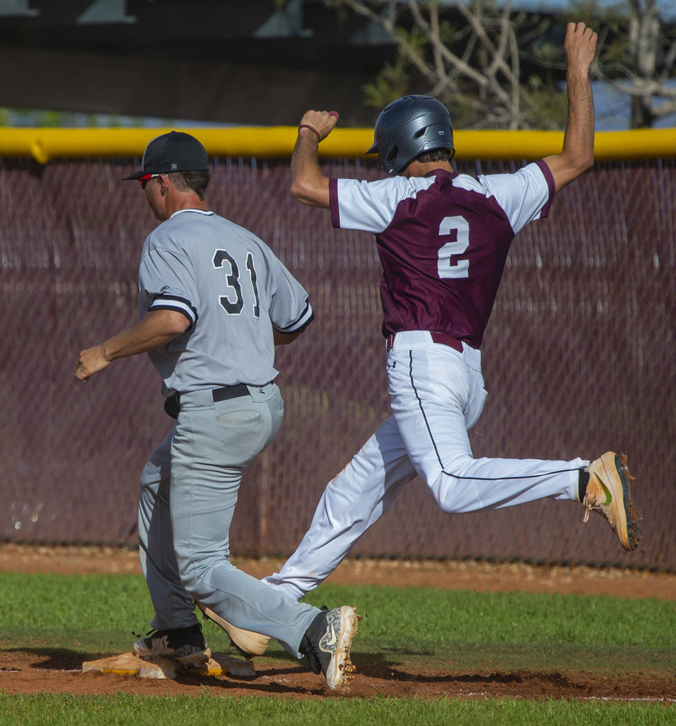 Palo Verde's Austin Raleigh (31) gets back to tag first base just ahead of Faith Lutheran runne ...