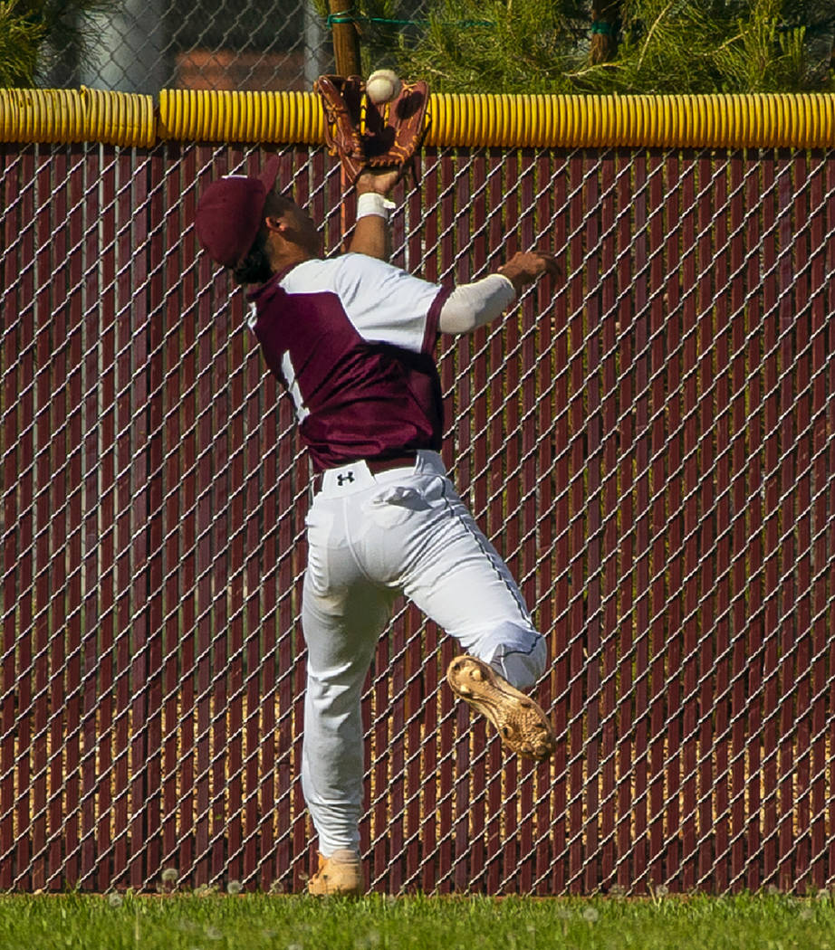 Faith Lutheran's Dylan Schafer (1) goes deep into center field for a catch from a Palo Verde ba ...