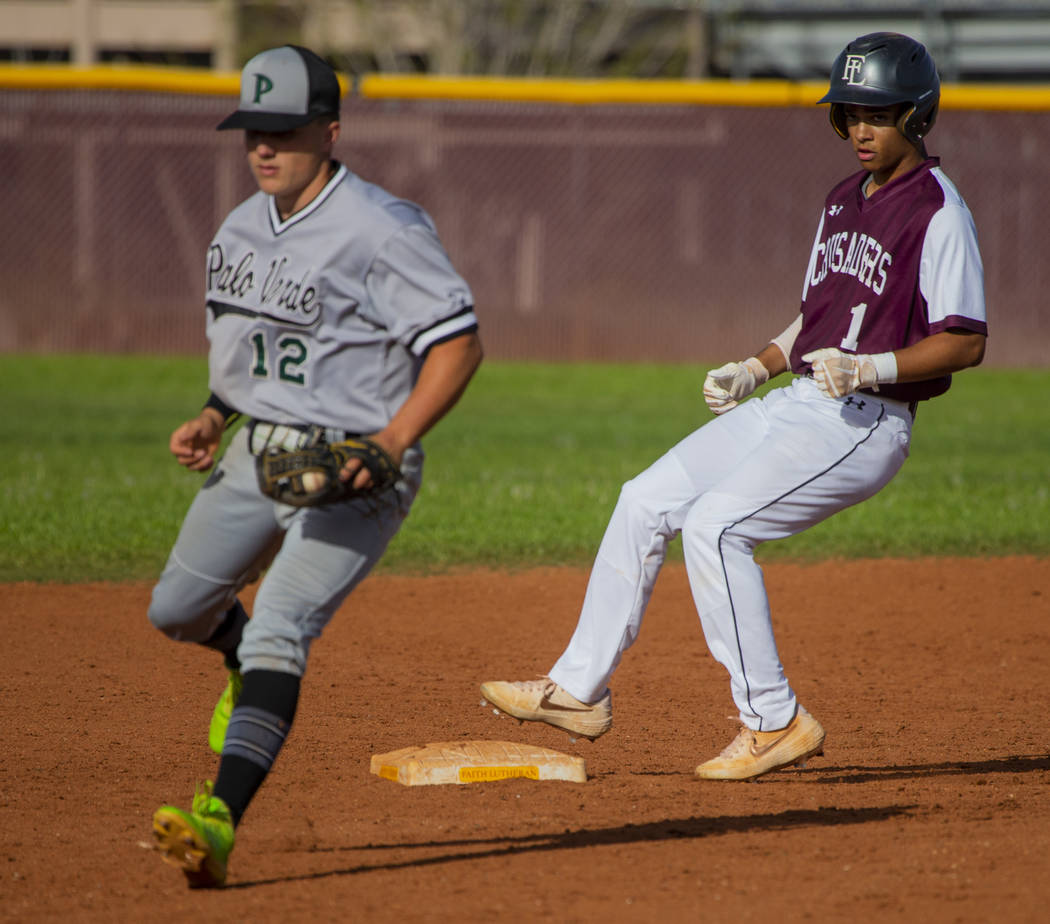 Palo Verde's (12) has to step off the bag for a wild throw as Faith Lutheran's Dylan Schafer (1 ...