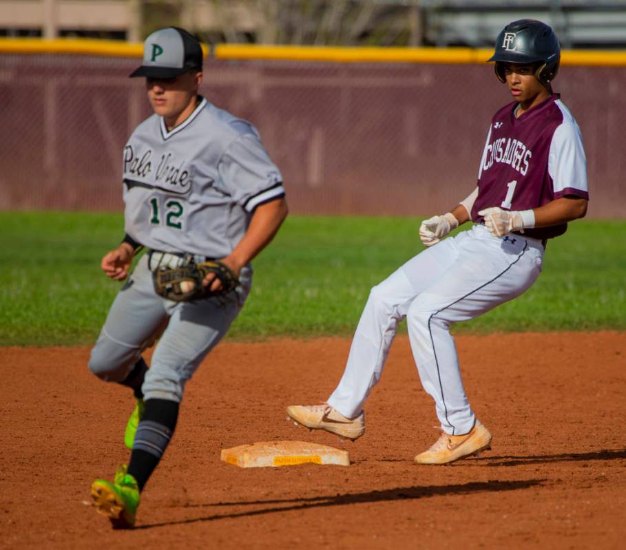 Palo Verde's (12) has to step off the bag for a wild throw as Faith Lutheran's Dylan Schafer (1 ...