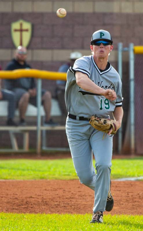 Palo Verde's Bryce Robison (19) slings a ball to first base ahead of a Faith Lutheran runner du ...