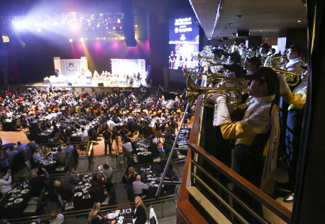 Members of the Arizona State marching band perform during the Las Vegas Bowl kickoff luncheon a ...
