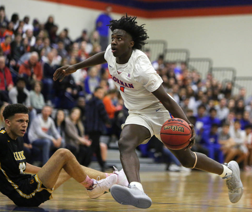 Bishop Gorman's Will McClendon (1) drives past Clark's Cameron Kimble (12) during the second ha ...