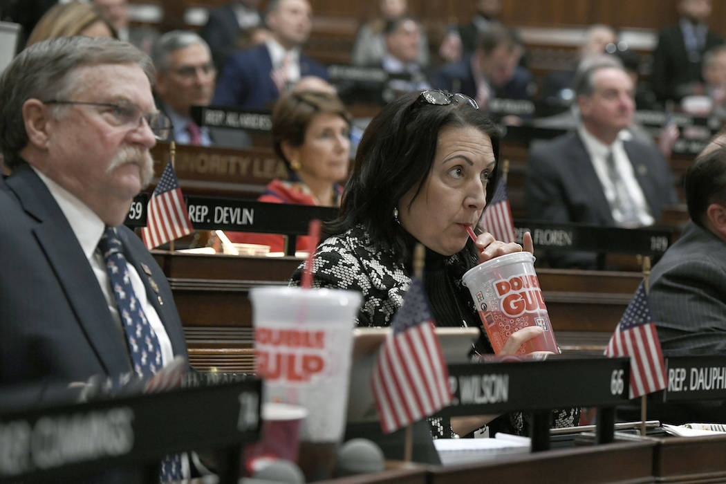 In this Feb. 20, 2019 file photo, state Rep. Anne Dauphinais R-Killingly, takes a sip from a bi ...