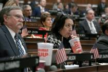 In this Feb. 20, 2019 file photo, state Rep. Anne Dauphinais R-Killingly, takes a sip from a bi ...