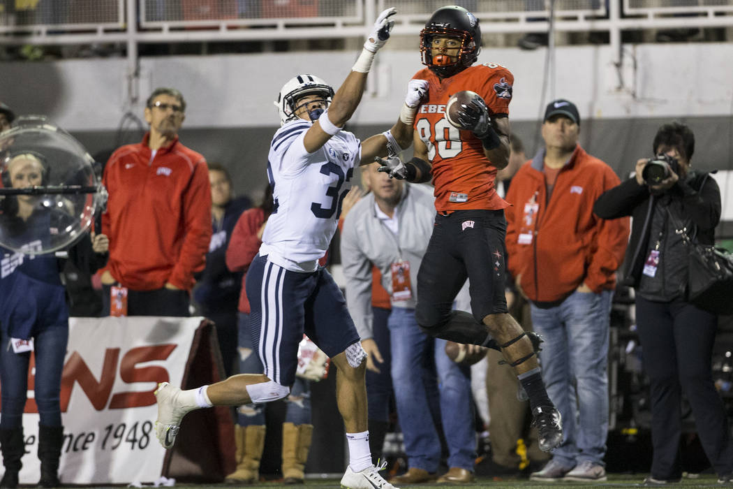 UNLV Rebels wide receiver Brandon Presley (80) makes a catch against Brigham Young Cougars defe ...
