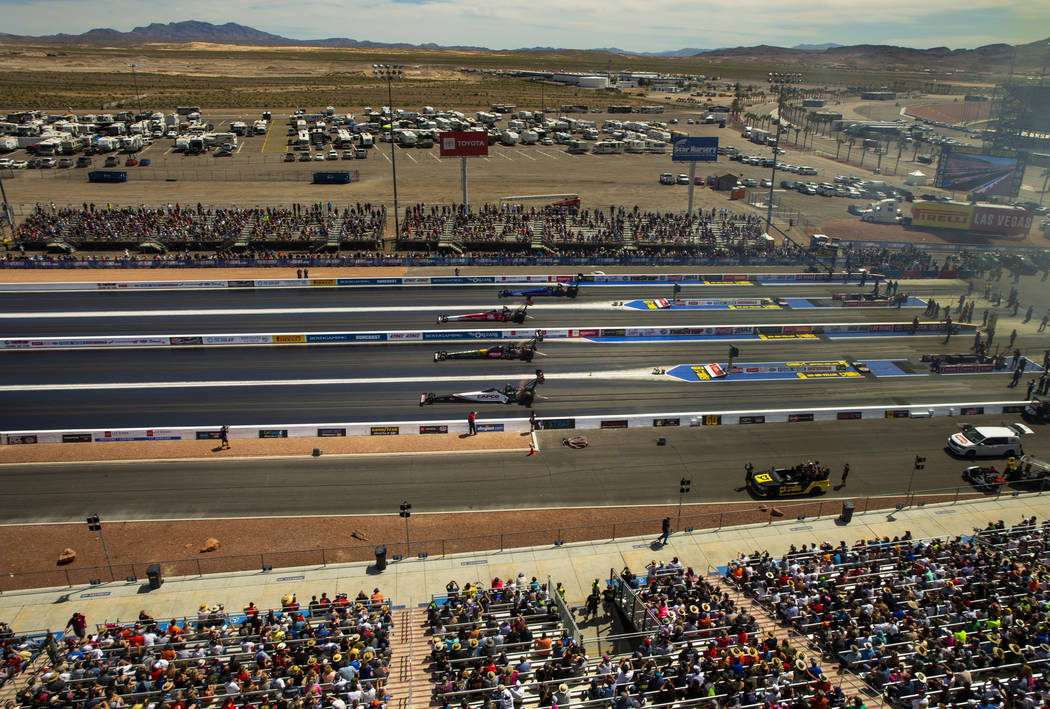 Top fuel cars race four across during the NHRA Mello Yellow Drag Racing Series on The Strip at ...