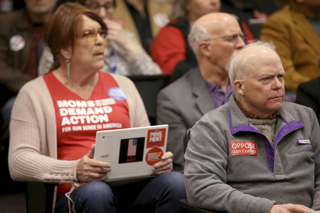 Diana Loring, of Reno, left, and Sandy Johnson, of Carson City, listen to testimony during a jo ...