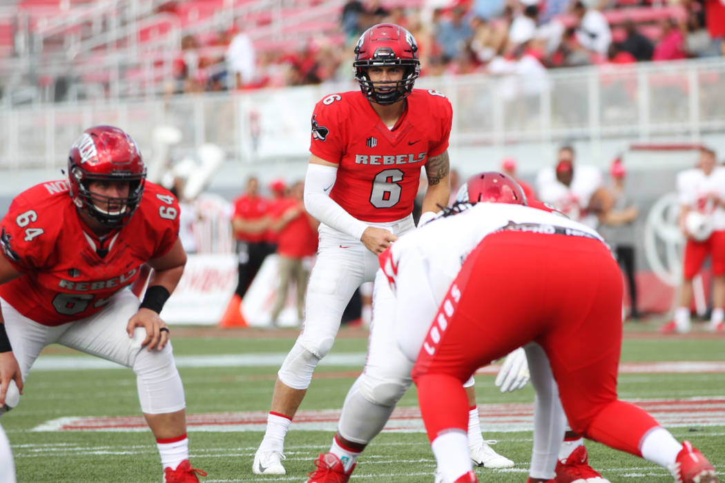 UNLV Rebels quarterback Max Gilliam (6) waits to snap the ball against New Mexico Lobos during ...
