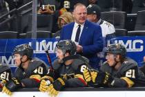 Golden Knights head coach Gerard Gallant, in blue, looks on during the second period of an NHL ...