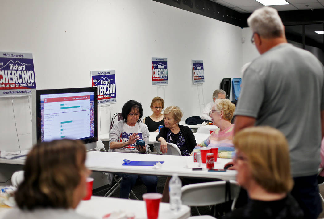 Friends and family of Councilman Richard Cherchio watch results come in for his re-election to ...