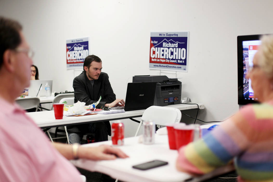 Campaign Manager Dennis Walters watches results at the watch party for Councilman Richard Cherc ...