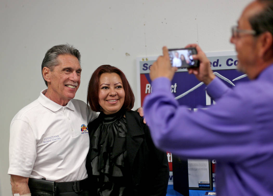 Eddie Escobedo takes a photo of Councilman Richard Cherchio with Mary Valadez at Cherchio's wat ...