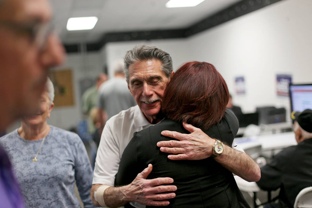 Councilman Richard Cherchio hugs Mary Valadez at a watch party for his re-election to Ward 4 fo ...