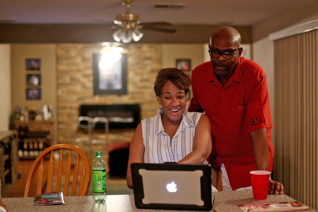 Councilwoman Pamela Goynes-Brown smiles with her husband Romero Brown as they look at results a ...