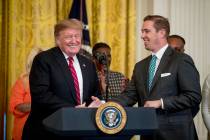 Former prisoner and law school professor Shon Hopwood, right, is invited to the podium by Presi ...