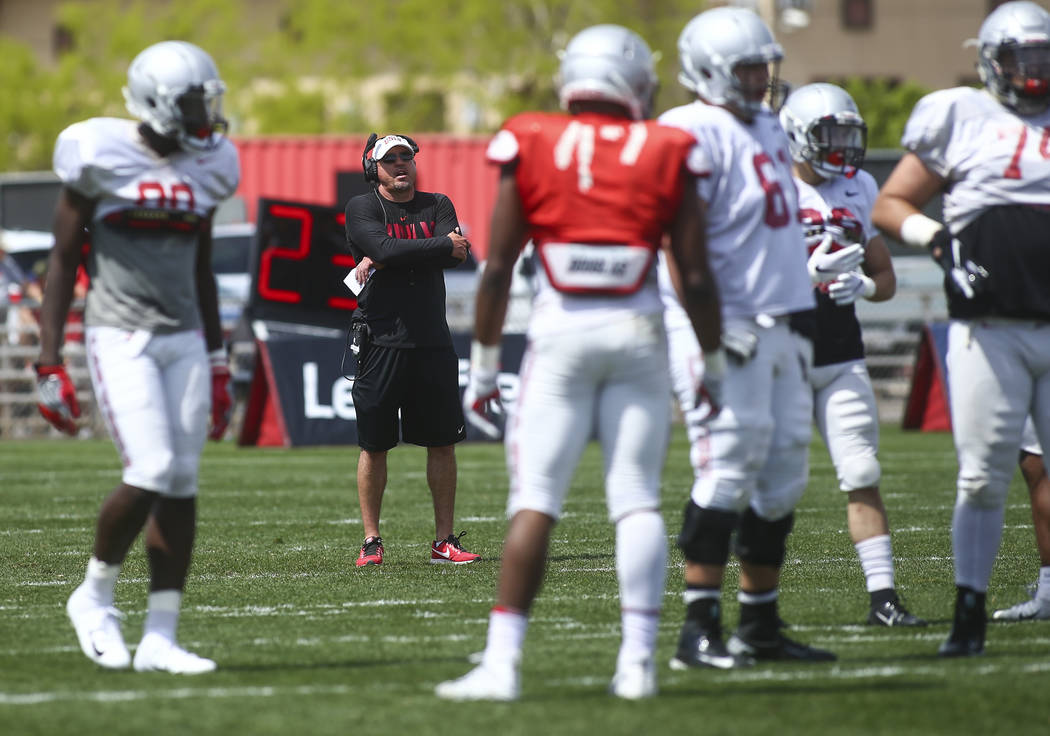 UNLV Rebels head coach Tony Sanchez watches his team during the spring football game at Peter ...