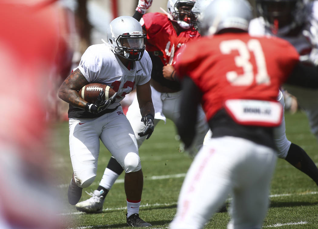 UNLV Rebels running back Tariq Hollandsworth (13) runs the ball during the spring football game ...