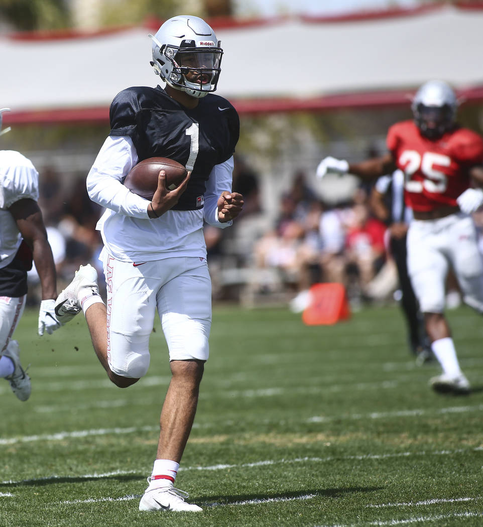 UNLV Rebels quarterback Armani Rogers (1) runs the ball during the spring football game at Pete ...