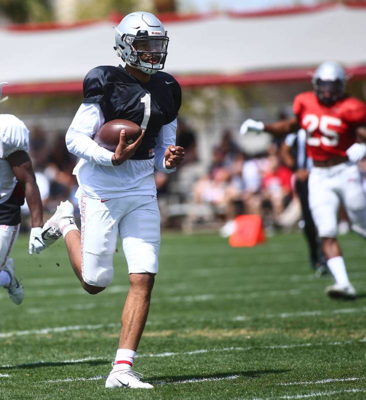 UNLV Rebels quarterback Armani Rogers (1) runs the ball during the spring football game at Pete ...