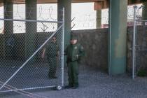Border Patrol agents guard a gate at the entrance to what was a temporary holding facility unde ...