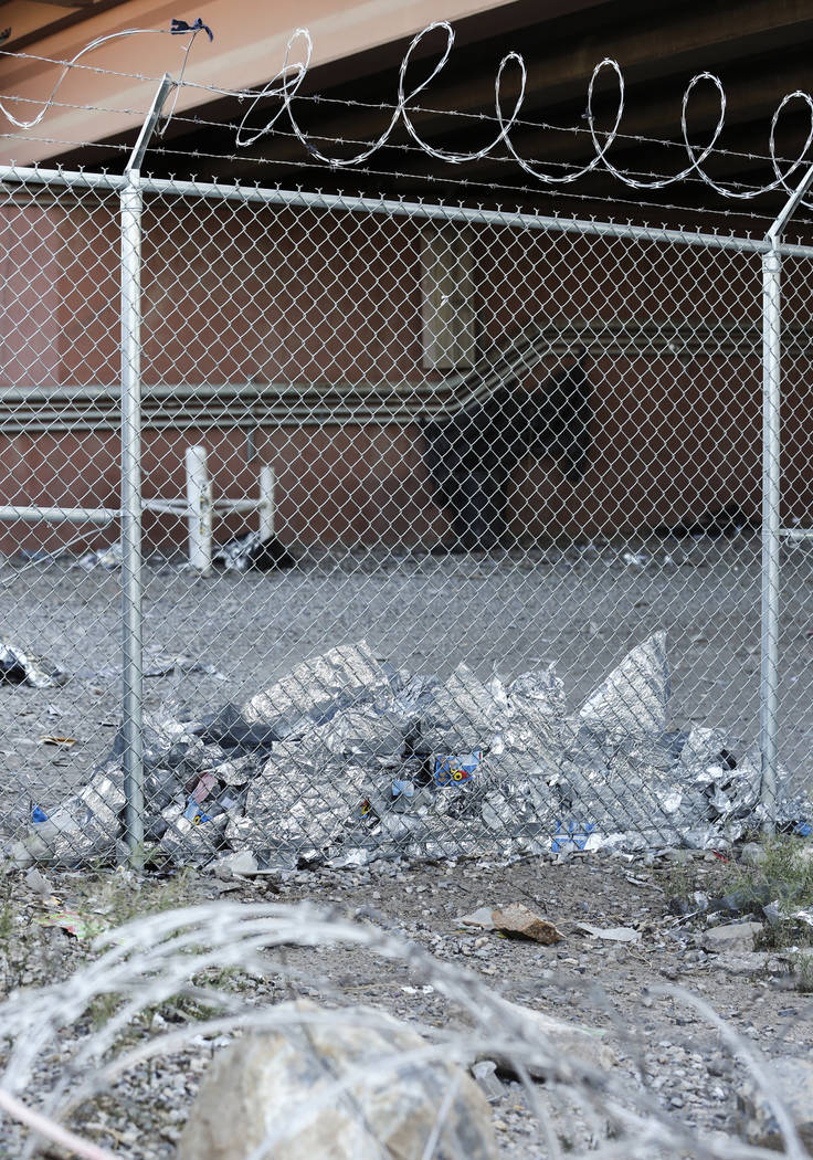 Shreds of Mylar blankets are seen under the Paso del Norte Port of Entry bridge in El Paso, Tex ...