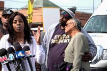 Marcus Woods, second from right, comforts Lita Herron, right, as Denise Francis Woods, second f ...