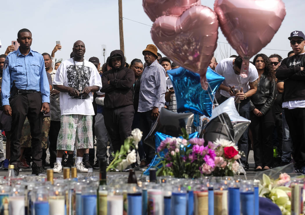 Fans of rapper Nipsey Hussle appear at a makeshift memorial in the parking lot of Hussle's Mara ...