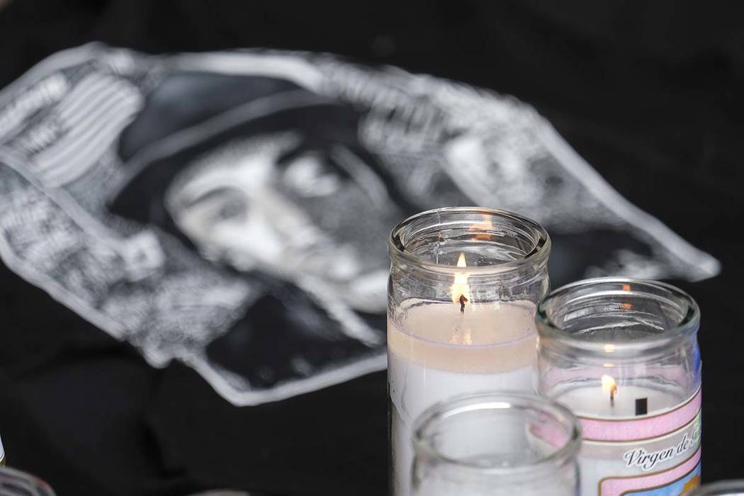 Candles appear at a makeshift memorial for rapper Nipsey Hussle in the parking lot of his Marat ...