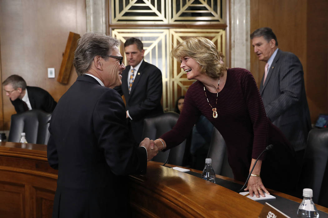 Energy Secretary Rick Perry, left, speaks with Sen. Lisa Murkowski, R-Alaska, chairwoman of the ...