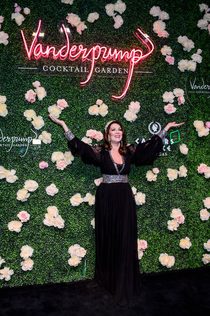 Lisa Vanderpump poses under a sign for her new Vanderpump Cocktail Garden at Caesars Palace. (C ...