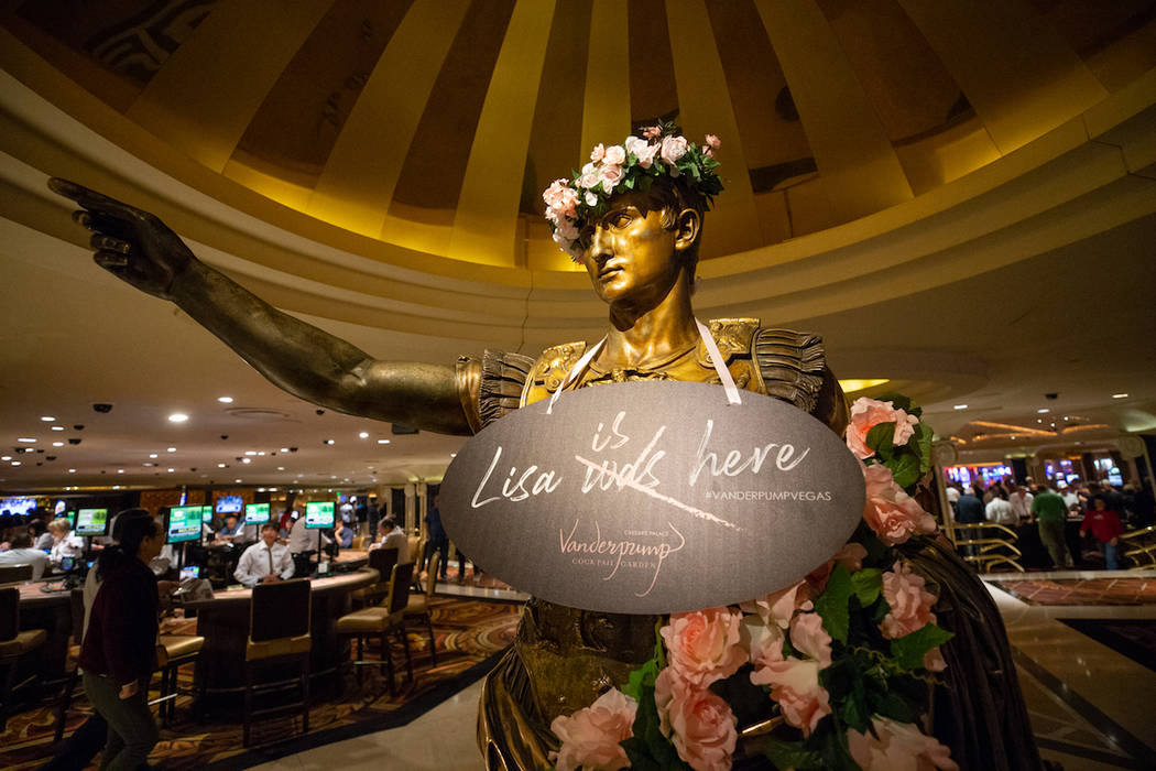 A statue inside Caesars Palace is adorned with pink roses in celebration of Lisa Vanderpump's n ...