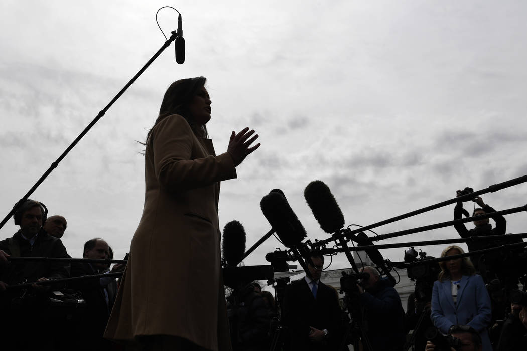 White House press secretary Sarah Sanders speaks to reporters outside the White House in Washin ...