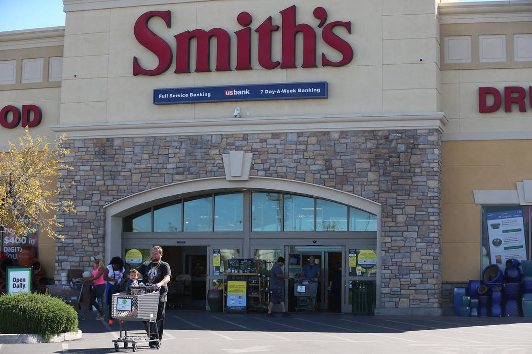 Tom Brown with his nephew Timmy Brown walk to their car after shopping at Smith's, 10600 Southe ...