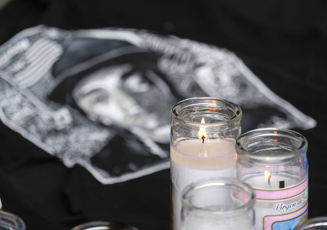 Candles appear at a makeshift memorial for rapper Nipsey Hussle in the parking lot of his Marat ...