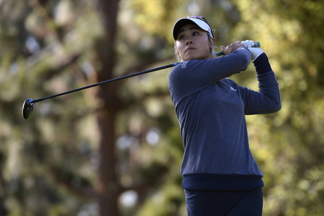 Danielle Kang plays her shot from the 13th tee during the first round of the Kia Classic LPGA g ...
