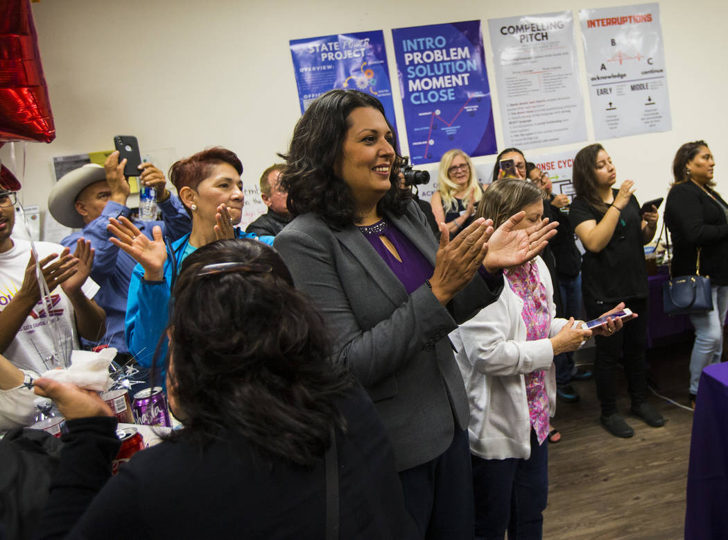Former assemblywoman Olivia Diaz, a Las Vegas City Council candidate for Ward 3, center, claps ...