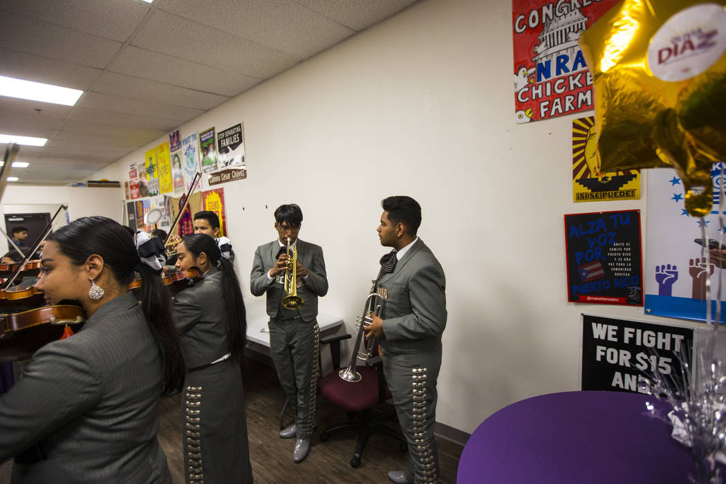 Members of Mariachi Alma del Canon, out of Canyon Springs High School, perform during an electi ...