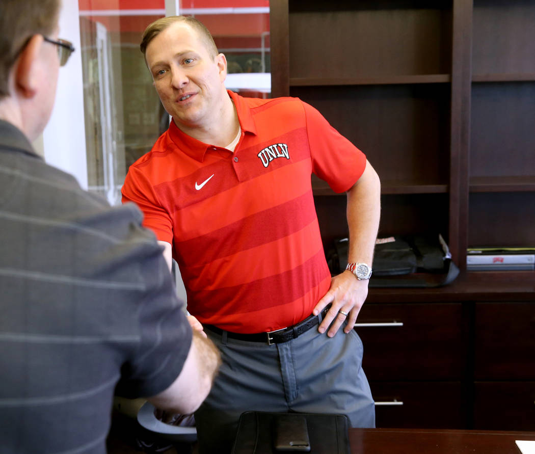 New UNLV basketball coach T.J. Otzelberger talks to a reporter in his office at the Thomas & ...