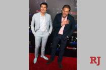 Actors Henry Golding, left, and Charlie Hunnam arrive at CinemaCon red carpet at The Colosseum ...