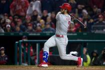 Philadelphia Phillies' Bryce Harper watches his double during the fifth inning of a baseball ga ...