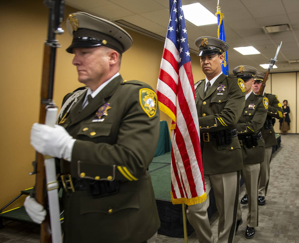 The Metropolitan Police Department honor guard marches with the colors opening a commendation c ...