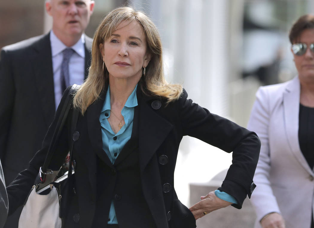 Actress Felicity Huffman arrives at federal court in Boston on Wednesday, April 3, 2019, to fac ...