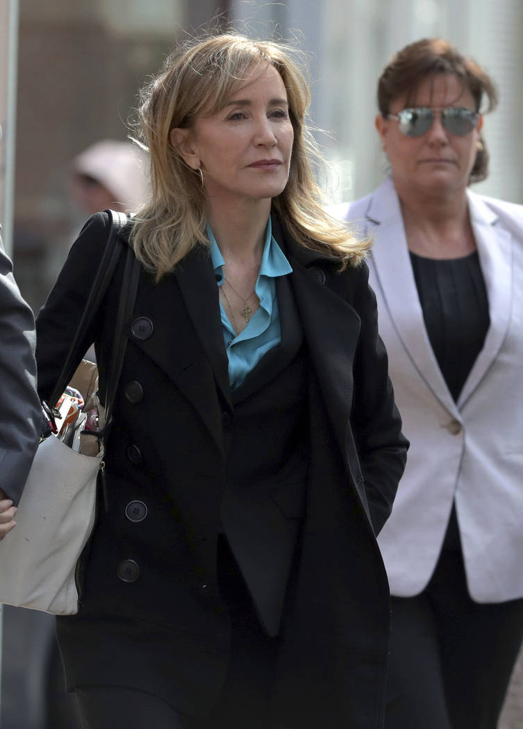 Actress Felicity Huffman arrives at federal court in Boston on Wednesday, April 3, 2019, to fac ...