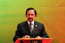 In this Oct, 10, 2013 file photo, Brunei's Sultan Hassanal Bolkiah speaks during the closing ce ...