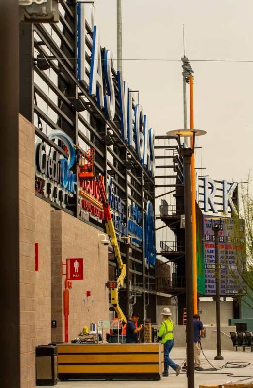 Crews complete finishing touches on the exterior of the Las Vegas Ballpark on Monday, April 8, ...