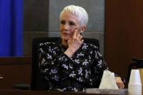 Former U.S. senator Harry Reid's wife Landra Gould points toward her left eye as she testifies ...