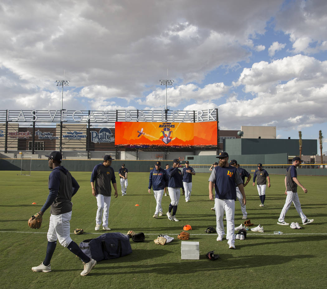 Aviators players warm up before the start of practice during media day at Las Vegas Ballpark on ...