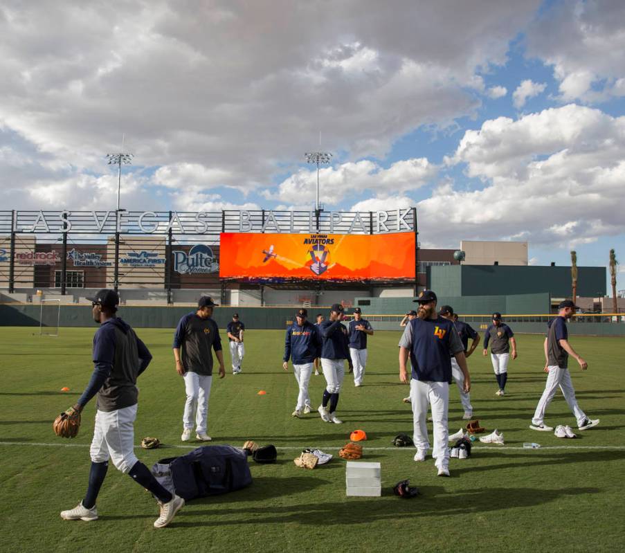 Aviators players warm up before the start of practice during media day at Las Vegas Ballpark on ...