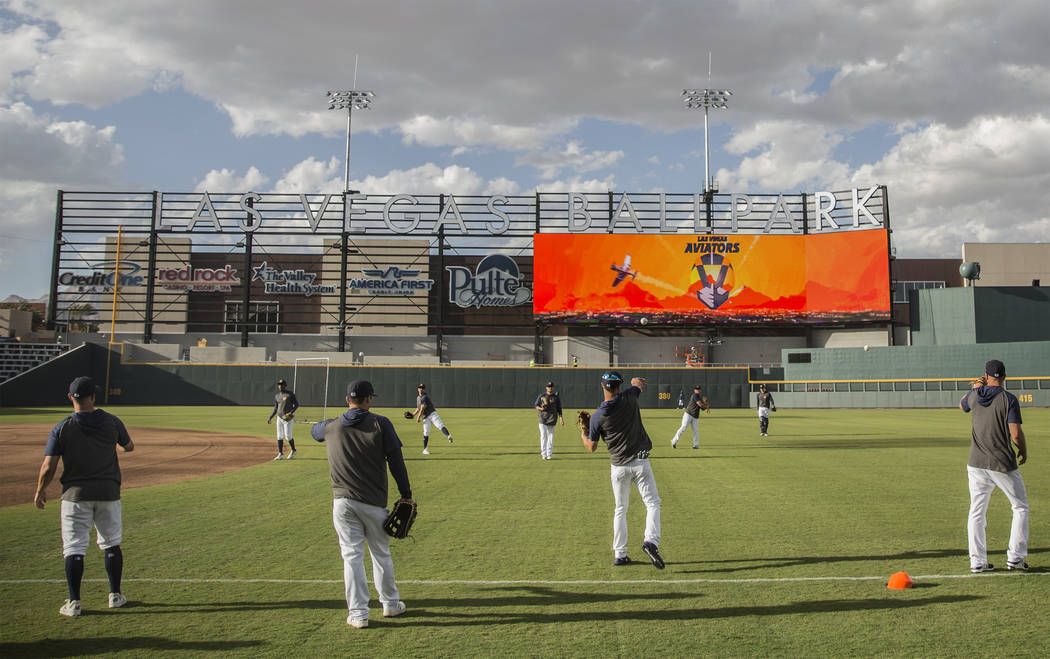 Aviators players warm up before the start of practice during media day at Las Vegas Ballpark on ...